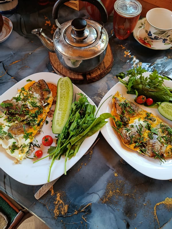 Egg and fish breakfast spread, plated and skillet-style