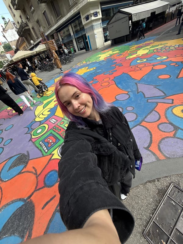 Tourist documents Zagreb street art and chocolate shops during morning walk