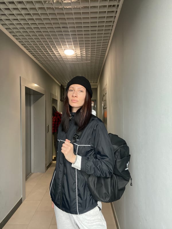Woman takes selfie in building entrance, Izhevsk