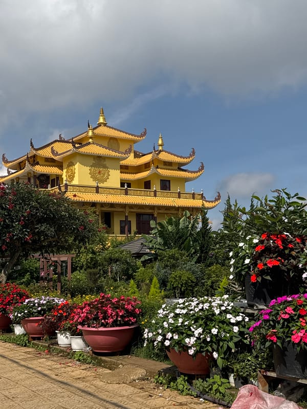 Golden Buddhist temple documented in Da Lat gardens