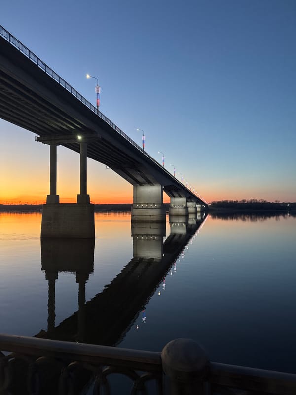 Illuminated Kama Bridge captured at dusk in Perm, Russia