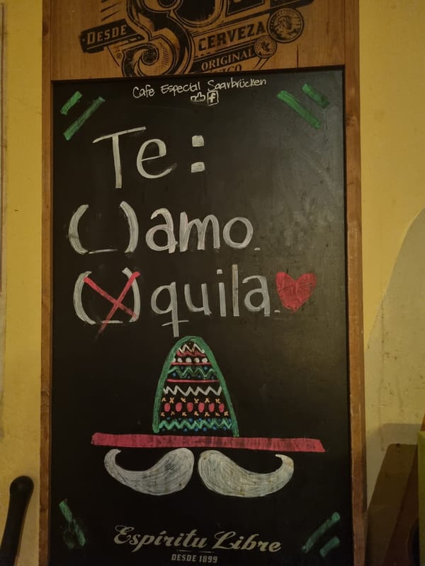 Evening bar scenes documented in Saarbrücken featuring chalkboard menu
