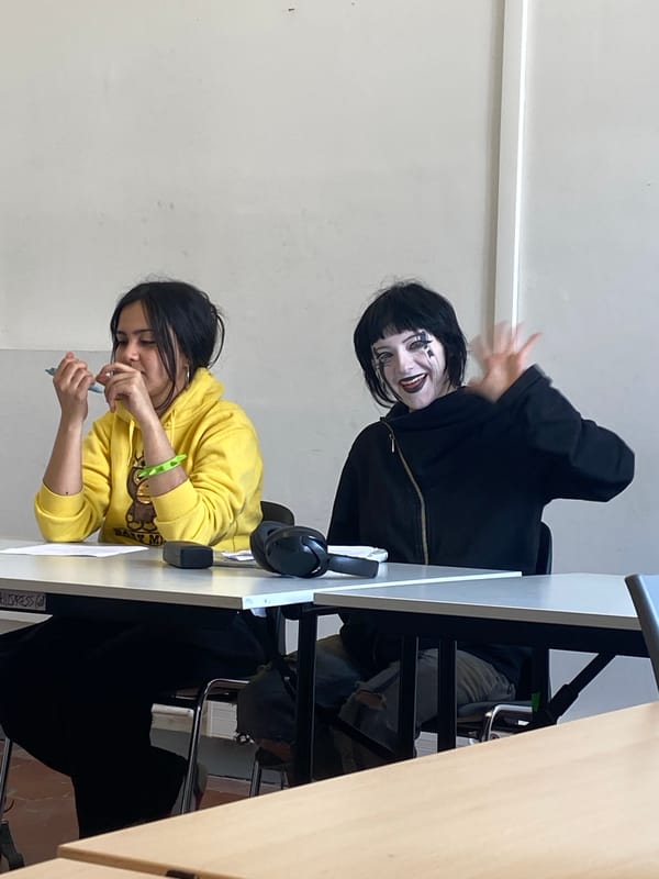 Students study indoors while sunny street life continues in Paris