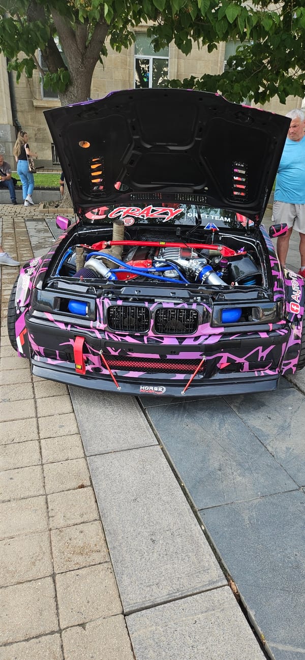 Modified racing cars displayed with open hoods in Ruse