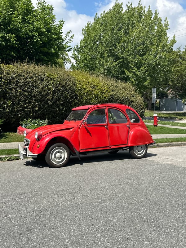 Red Citroen 2CV spotted parked on New Westminster street