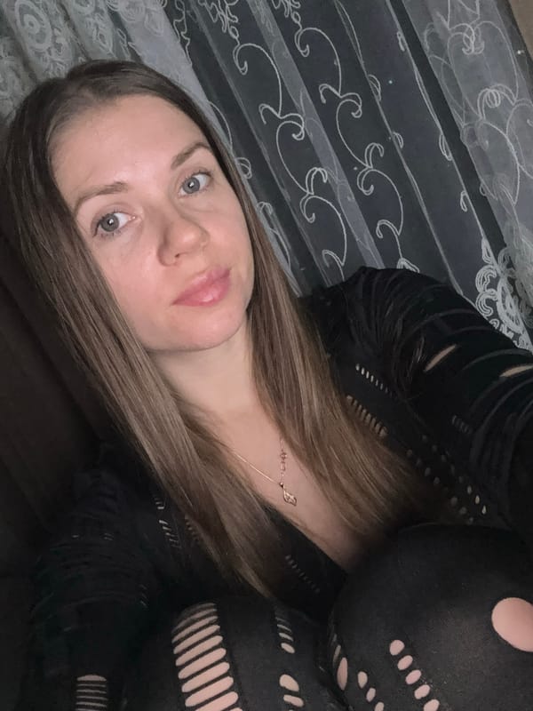 Woman observed indoors in Batumi, Georgia evening hours