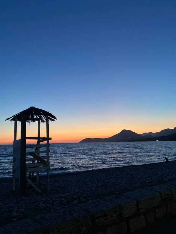 Evening coastal scenes and Cyrillic displays documented in Bar
