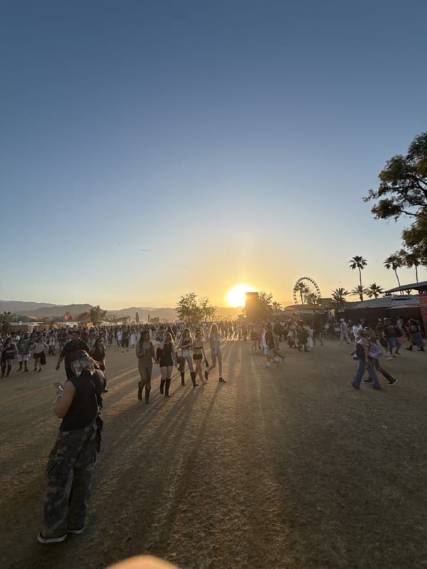 Music festival crowd gathers under lights in Indio