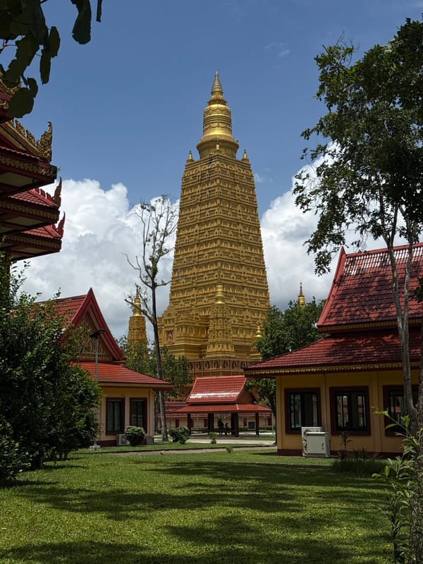 Inside and outside a ornate Buddhist temple in Na Nuea
