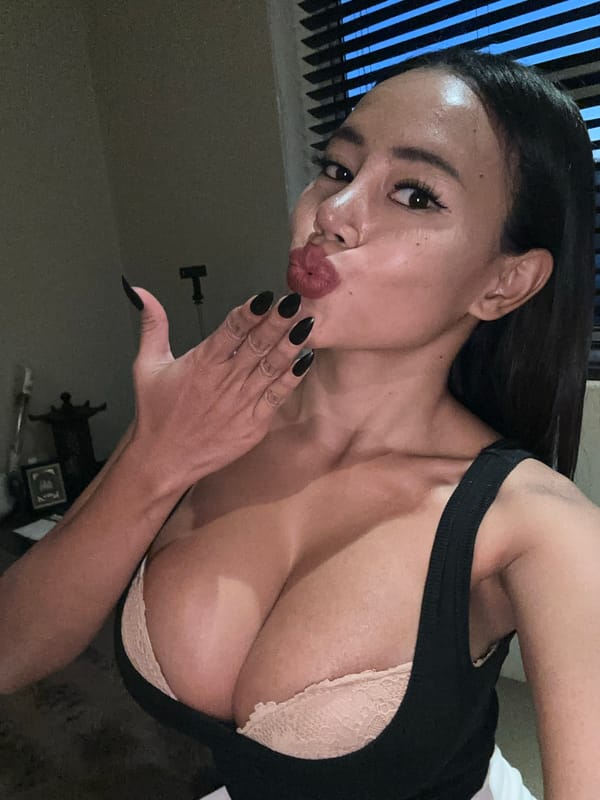 Woman takes selfie with kiss pose in Maroubra