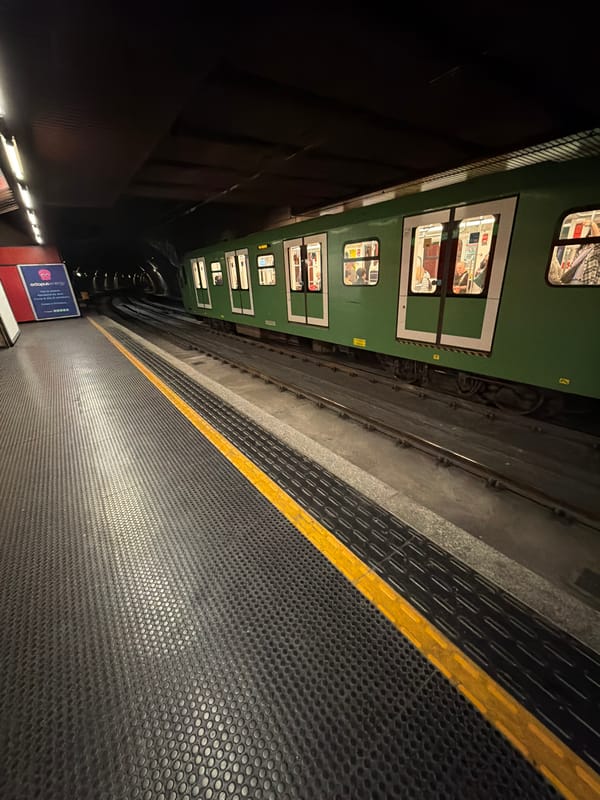 Milan Metro train makes routine stop with passengers aboard