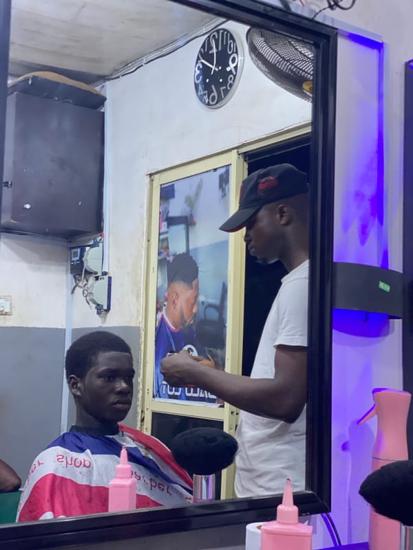 Mirror selfies and barbershop scenes captured in Ado, Nigeria