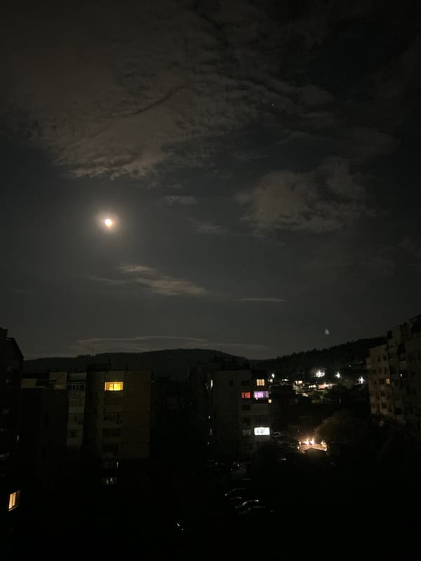 Bright moon observed through cloudy night sky in Shumen