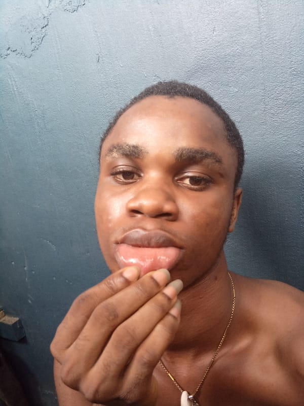 Young man photographed in various poses in Owerri residence