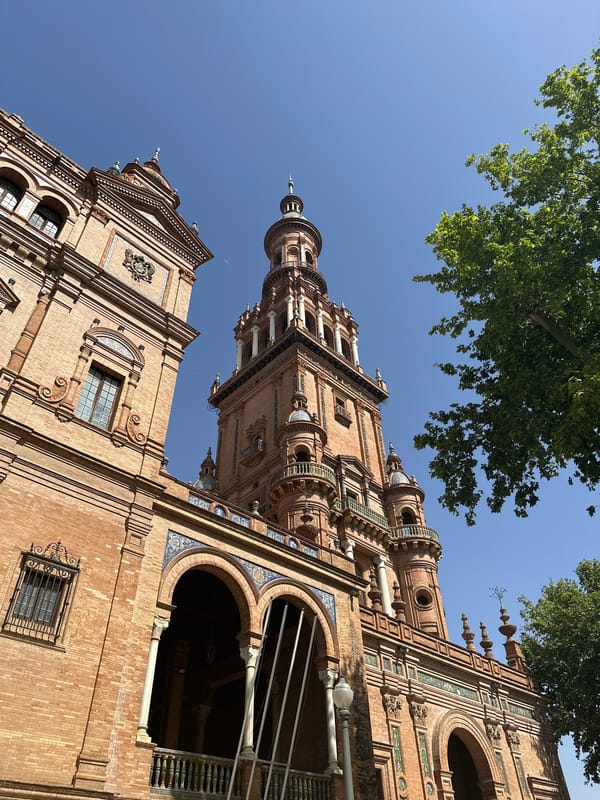 Ornate building photographed in Seville against blue sky