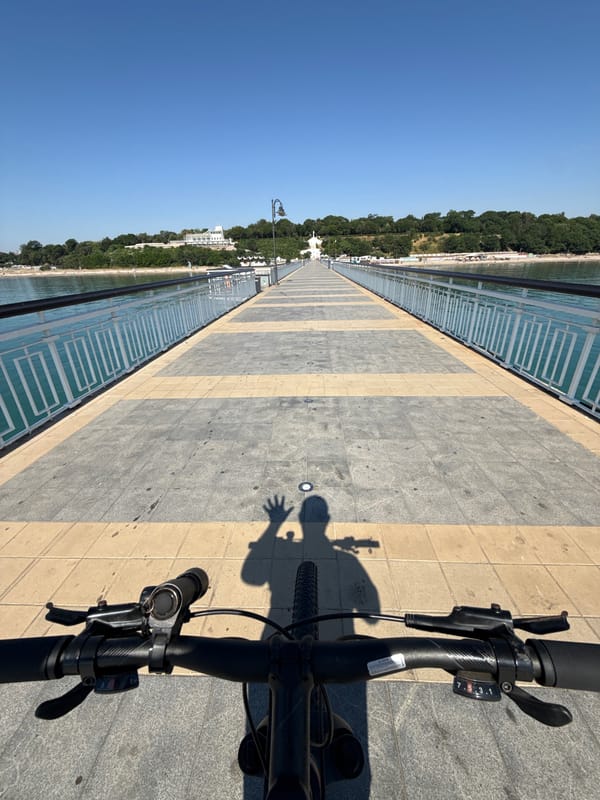 Cycling out along a tiled pier into the Black Sea