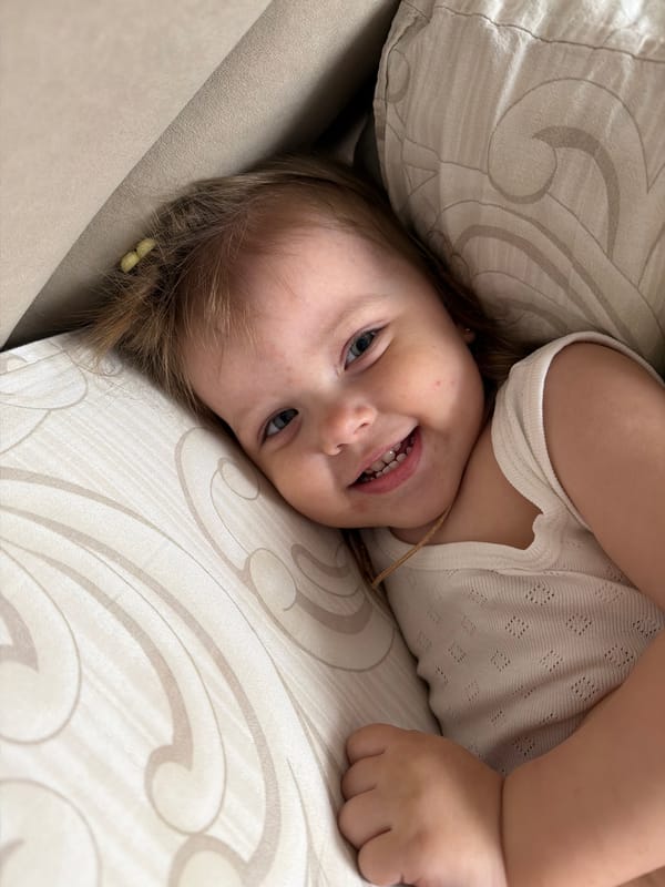 Young girl photographed on cushion in Reshetnikovo, Russia