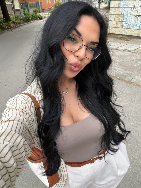 Woman takes selfie in urban setting