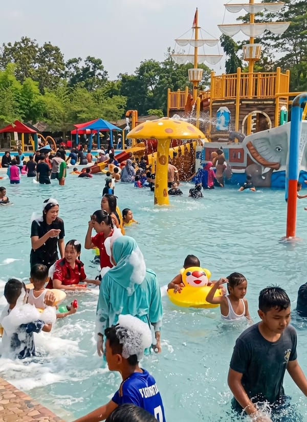 Families enjoy busy morning at Indonesian water park