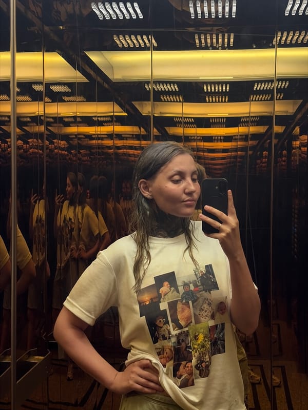 Woman takes selfie in mirrored space in Đà Nẵng