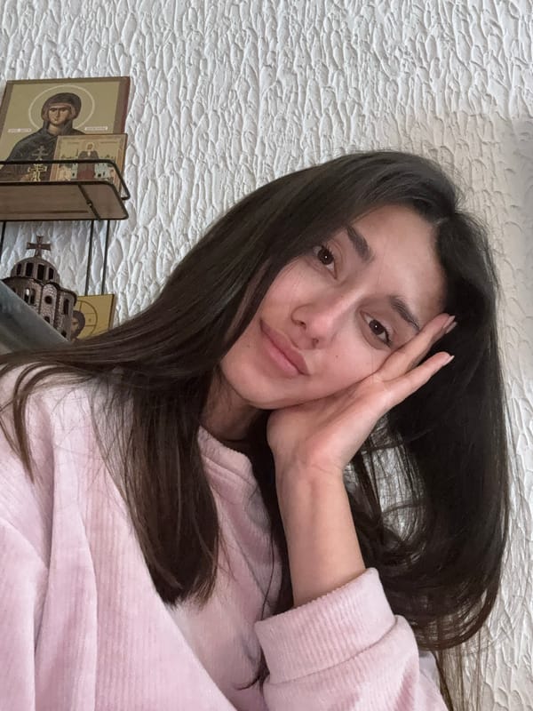 Woman Takes Selfie in Pink Sweater in Sutomore