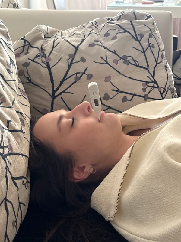Woman takes temperature reading while resting in Kragujevac