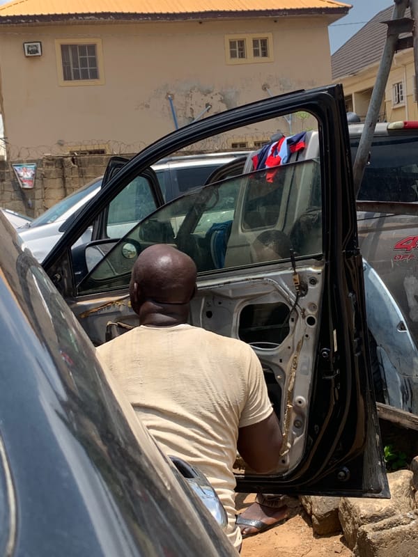 Car repairs and daily life captured in Kagini, Nigeria