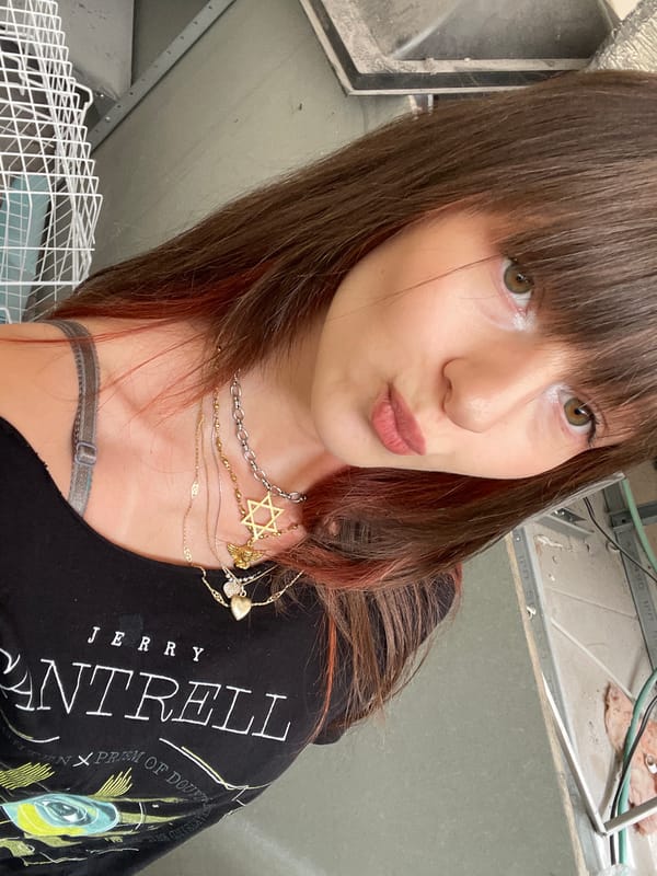 Woman takes selfies wearing Jerry Cantrell shirt in Raanana