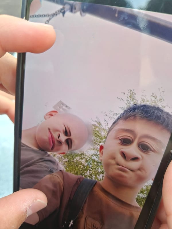 Boys play with phone filters at Saint Petersburg playground