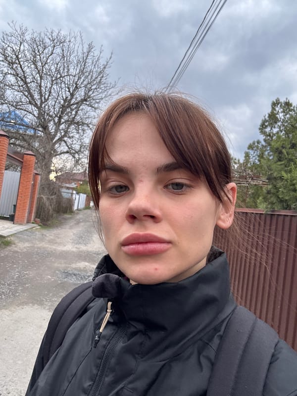 Woman photographs herself resting at home in Rostov-on-Don