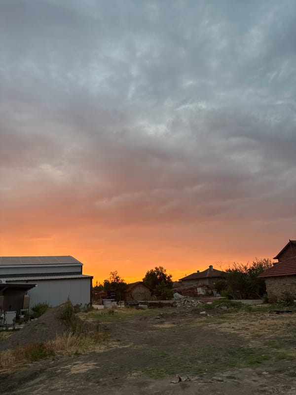 Vivid dusk sky over quiet village streets in Malevo, Bulgaria