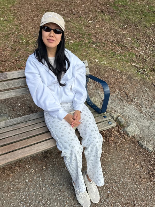 Woman rests on park bench in North Vancouver