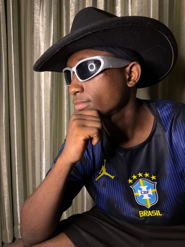 Posing in a Brazil jersey and cowboy hat, indoors in Jiangjin