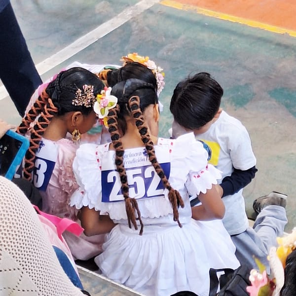 Girls in traditional dress participate in cultural event, Miraflores