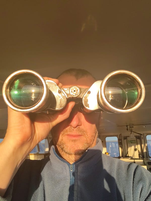 Man with binoculars spotted on ship bridge near Russia