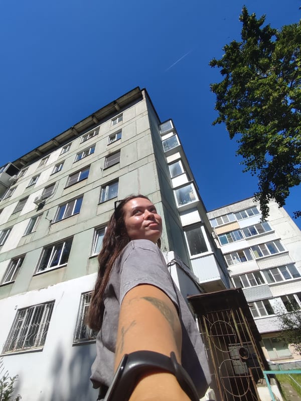Summer morning near a Soviet apartment block in Chaikovsky