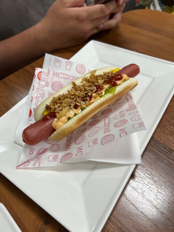 Hot dogs and coffee on a wooden table in rural Russia