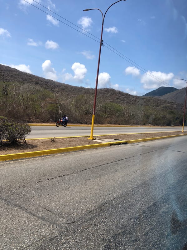 Motorcycle rides median strip on La Asuncion road