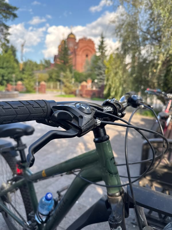 Bike stop at Il'inskiy's Orthodox cathedral on a summer afternoon