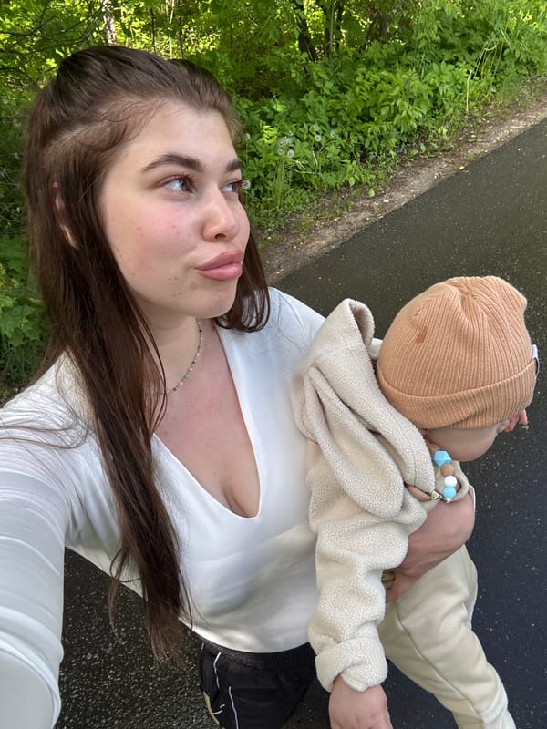 Woman with baby enjoys park outing in Шевlягино, Russia