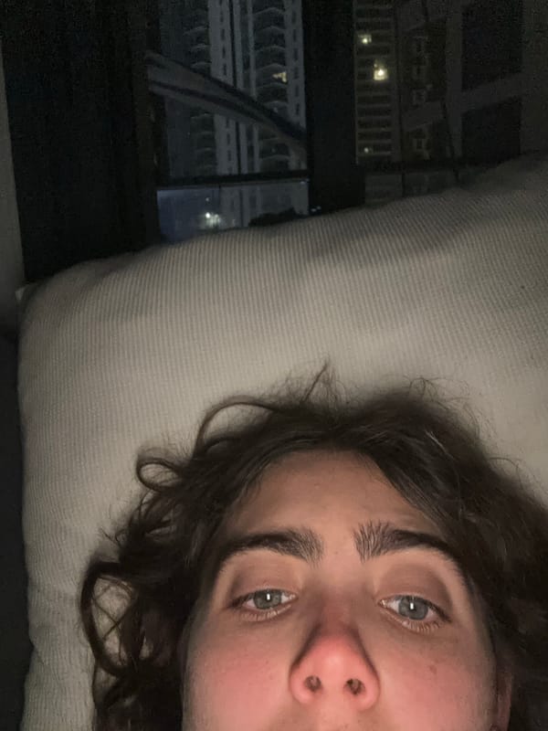 Person photographed resting on pillow indoors in Jordan