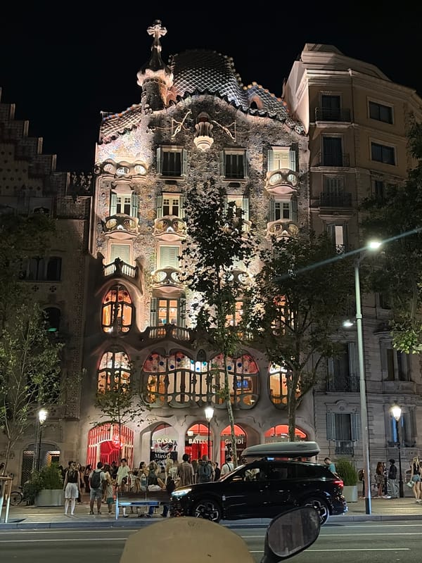 Casa Batlló glowing at night on Passeig de Gràcia