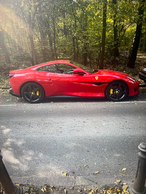 Ferrari spotted, women photograph themselves in decorative building