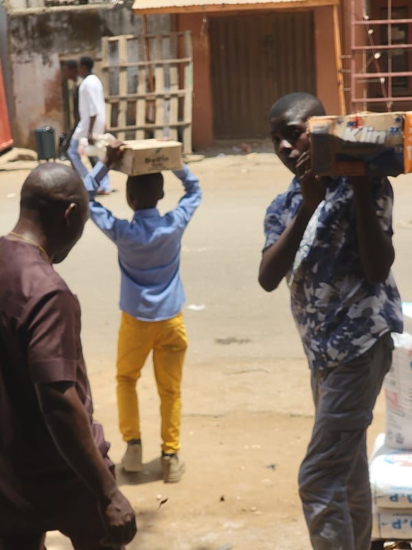 Men carrying goods observed in Maiburiji, Nigeria
