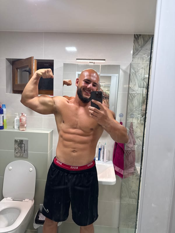 Mirror selfies in a Sofia bathroom, flexing for the camera