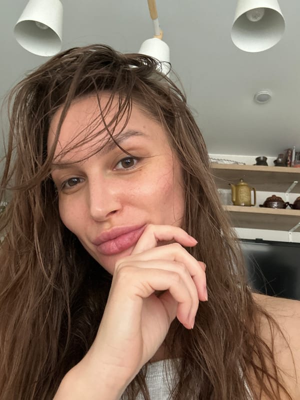 Woman with wet hair photographed in indoor setting