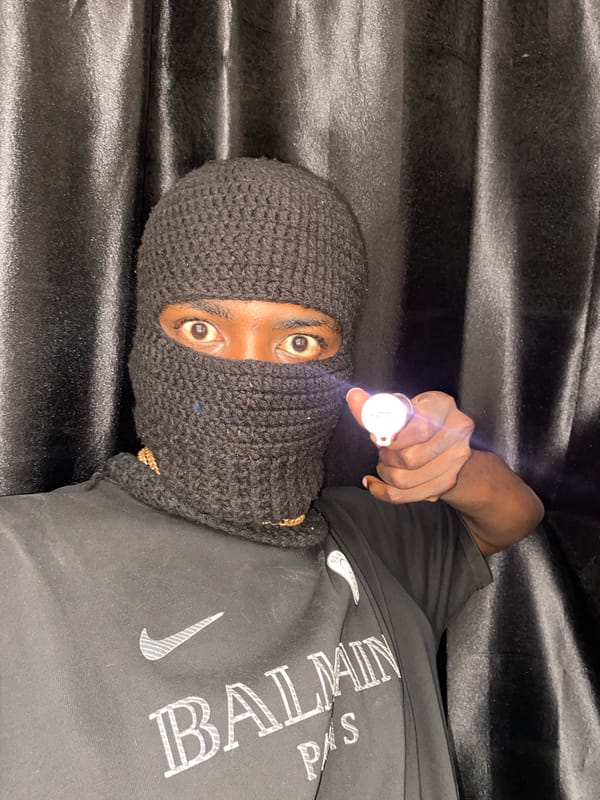 Masked individual photographed repeatedly in Nigeria morning session