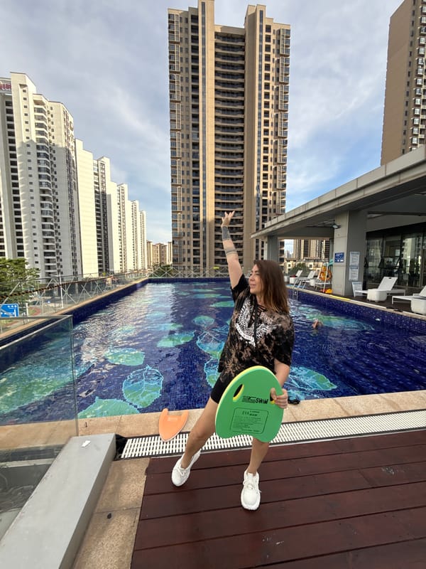 Rooftop pool day in Huizhou, with city views all around