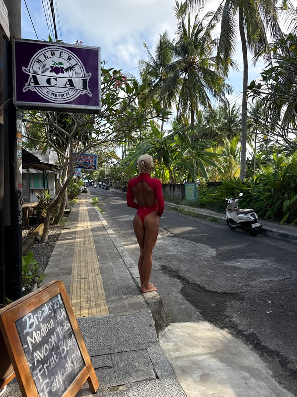 Tropical street scene with palm trees documented by witness