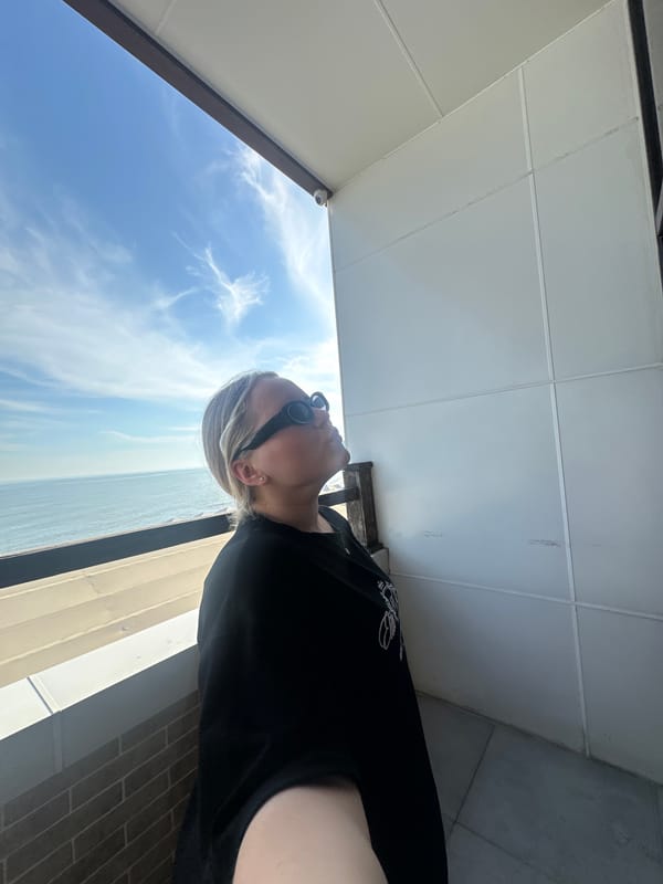Woman documents seaside afternoon in Lermontovo, Russia